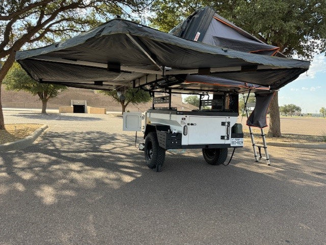 and open storage.|An off-road camping trailer with a rooftop tent