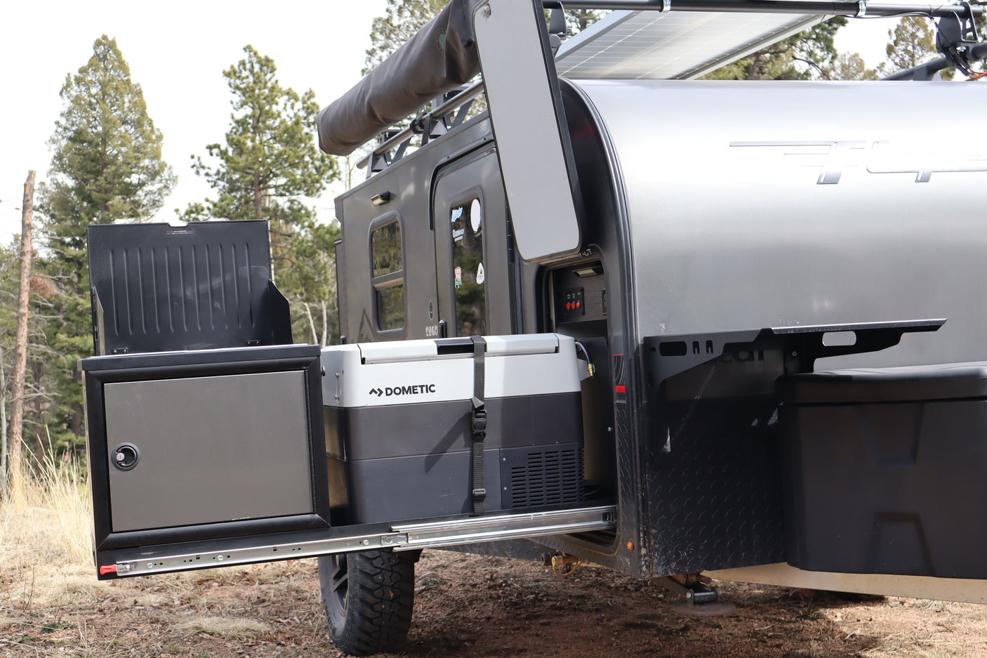 RV rental: Off-road teardrop camper with pull-out Dometic fridge, solar panel, & awning for outdoor adventures.
