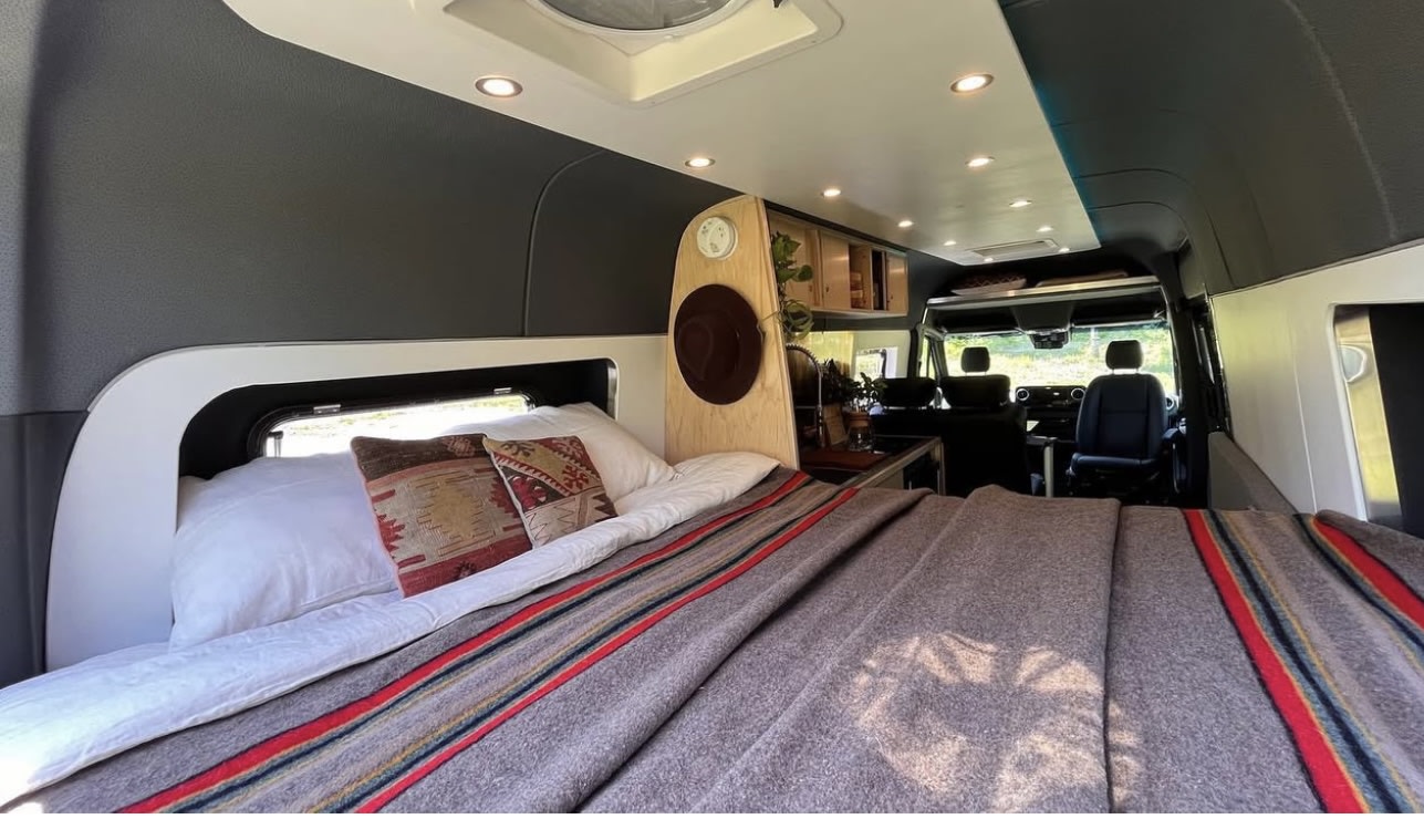 showing a comfy bed at the rear