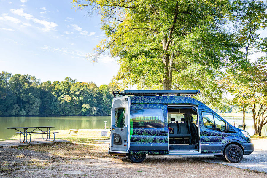 perfect for an RV rental adventure with built-in bike storage.|Spacious RV rental camper van with side door open