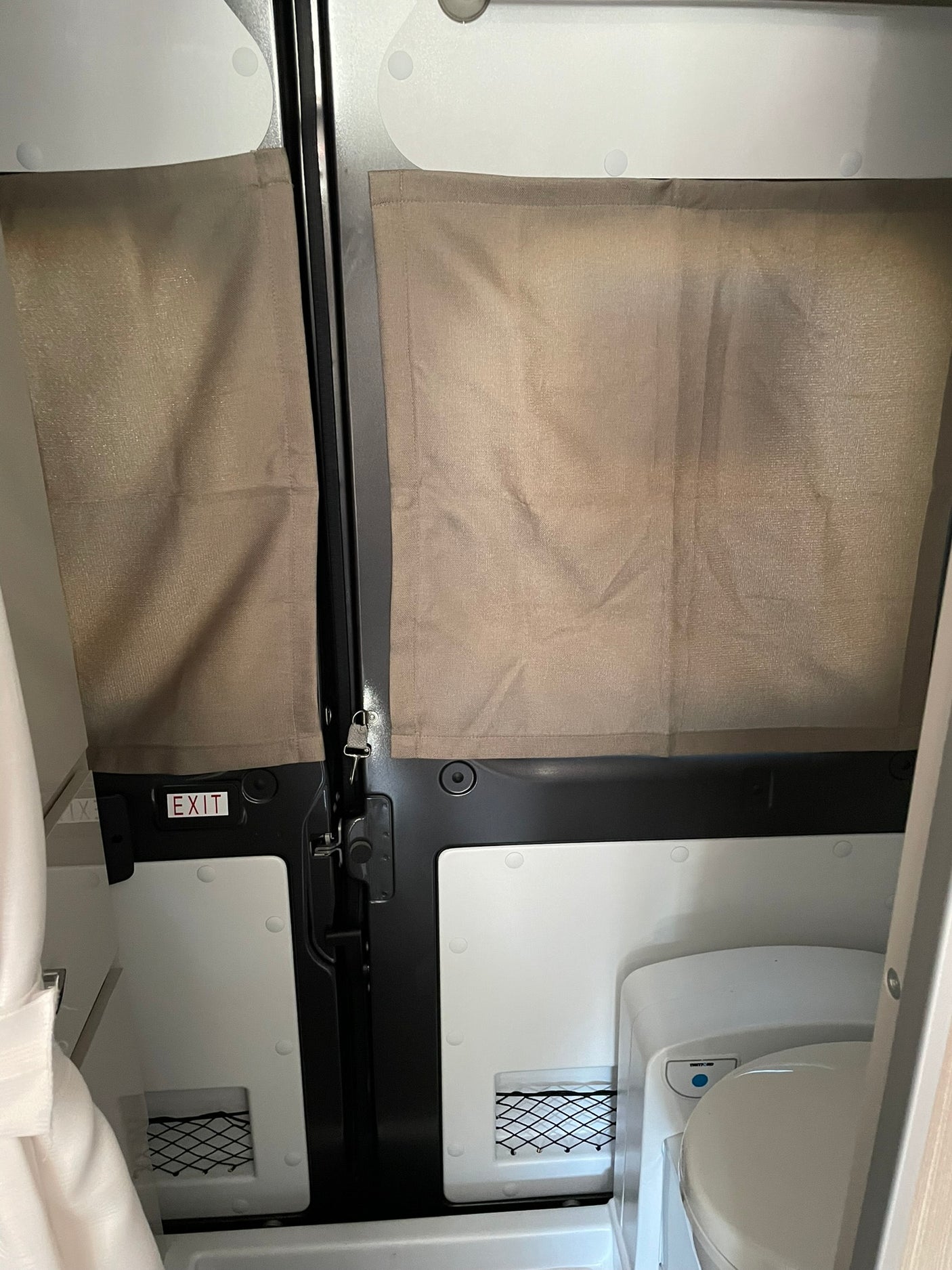 and built-in refrigerator. Ideal for road trips!|Compact RV rental kitchen interior featuring a sink