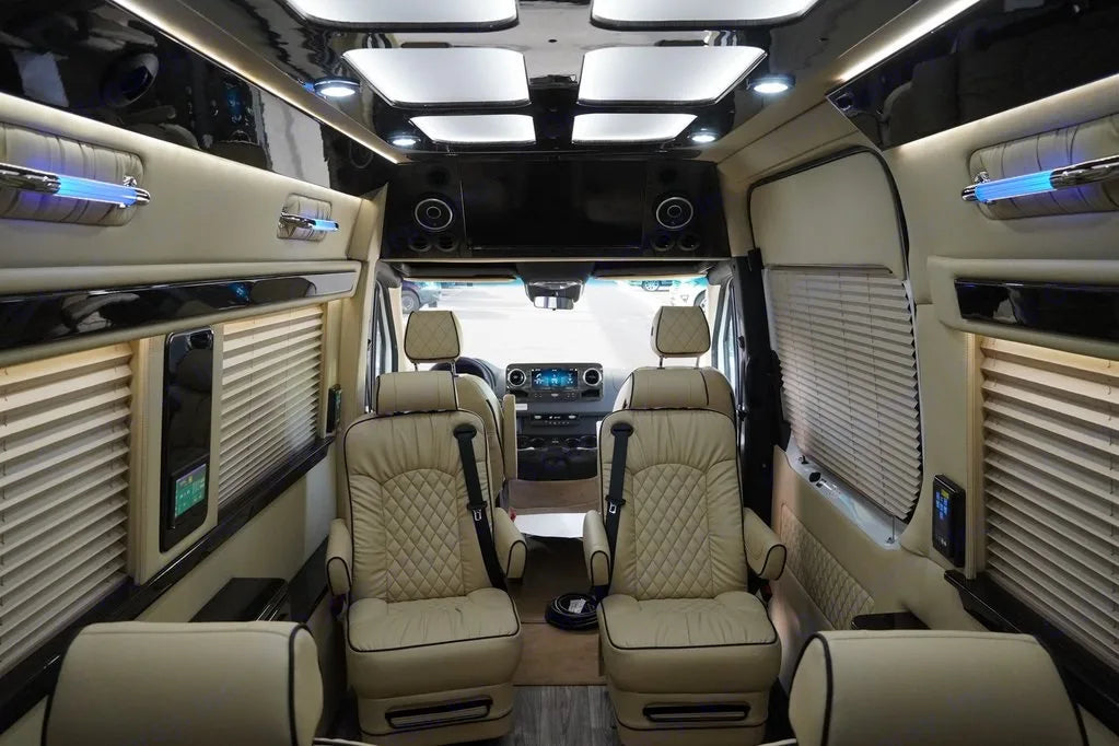 and elegant lighting for enjoyable travel.|Luxurious RV rental interior with cream leather seats