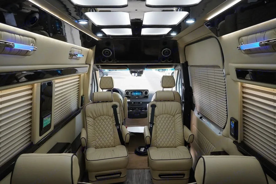 and elegant lighting for enjoyable travel.|Luxurious RV rental interior with cream leather seats