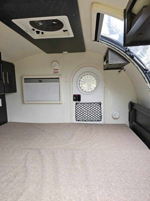 features a unique round door