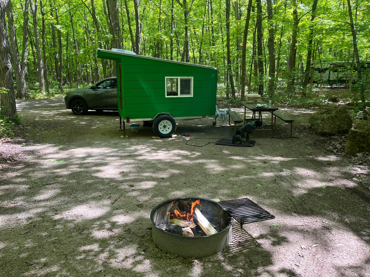 This compact green RV rental provides a cozy camp experience