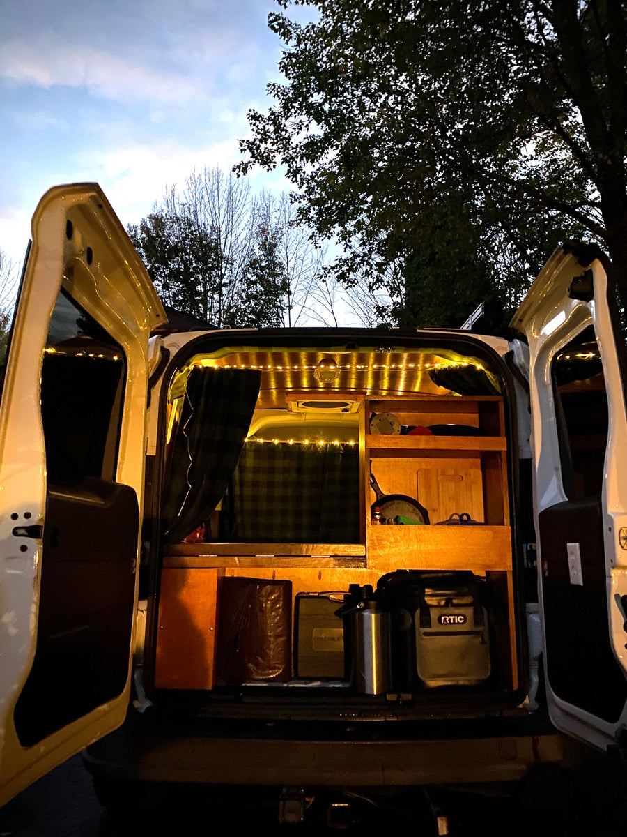 Cozy camper van interior seen from the rear