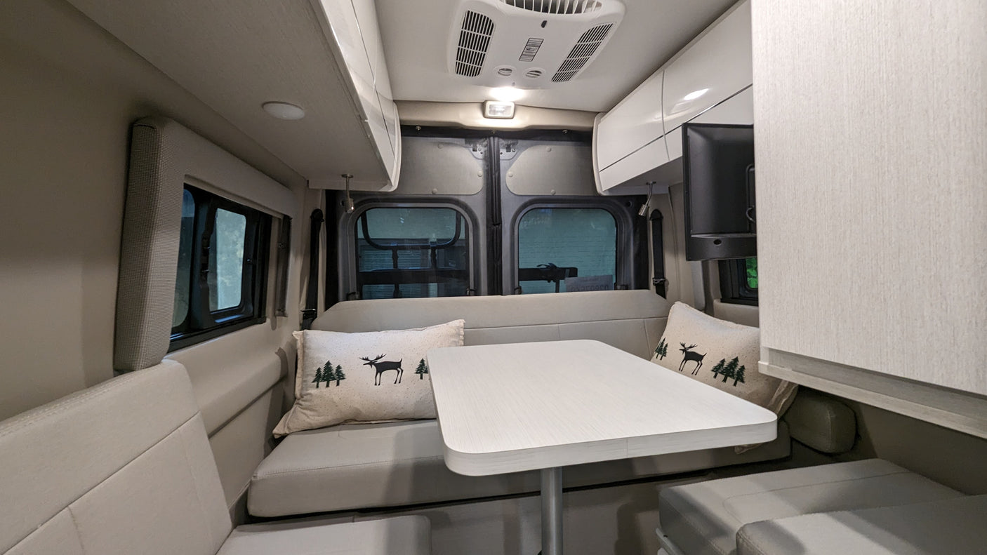 a fire truck and a GMC truck.|Spacious RV rental interior