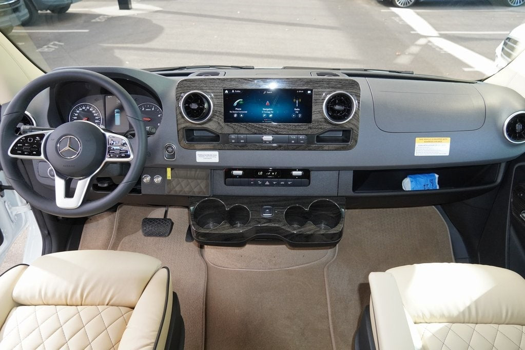 ready for your rv rental.|Luxurious RV rental interior with plush cream leather seats and entertainment system