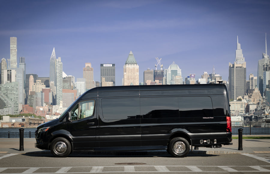 parked before a stunning city skyline.|Sleek black Mercedes-Benz Sprinter RV rental parked with a vibrant NYC skyline background. Ideal for luxury travel.|Cream-colored