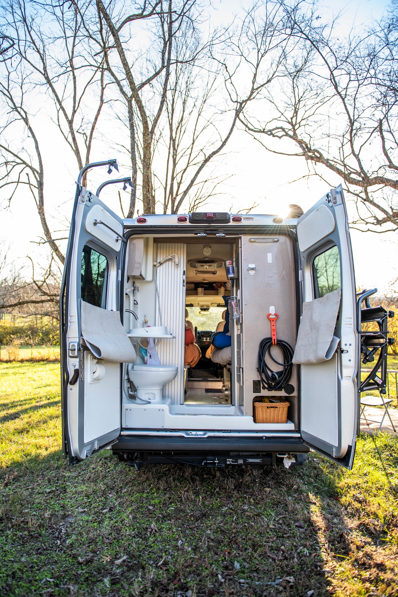 Explore this RV rental's versatile interior with a built-in toilet and shower, ideal for mobile adventures.