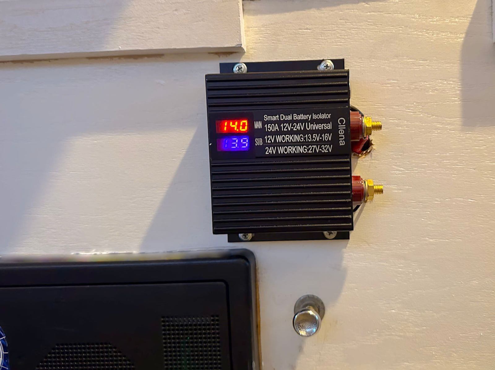 Cllena Smart Dual Battery Isolator in an rv rental, displaying main 14.0V & sub 13.9V battery voltages for power monitoring.