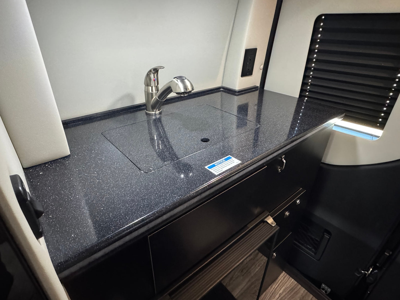 and an entertainment screen.|Luxury RV rental interior with comfortable seating