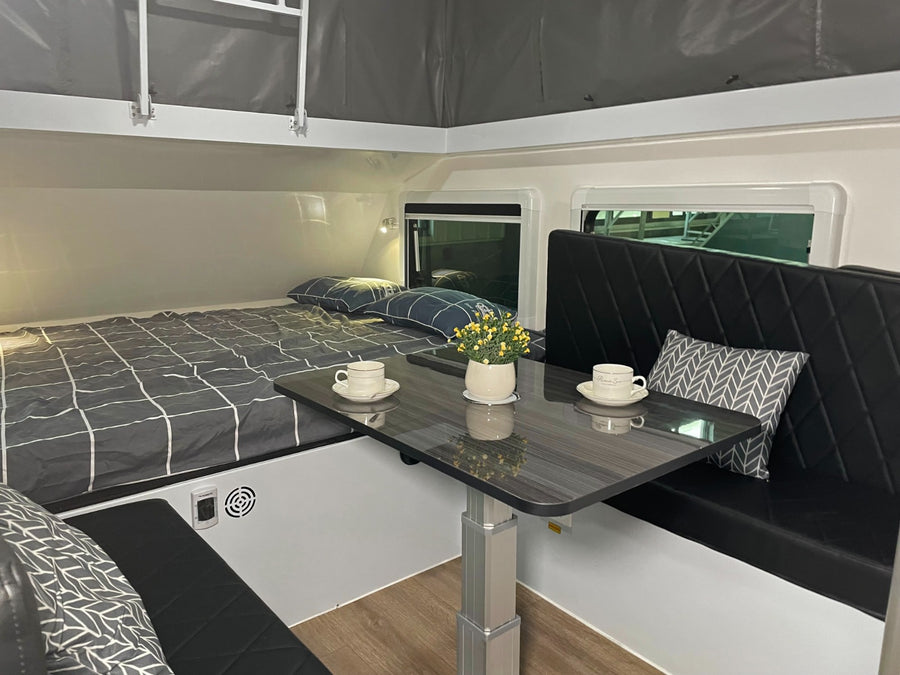 An RV rental interior with a comfy bed