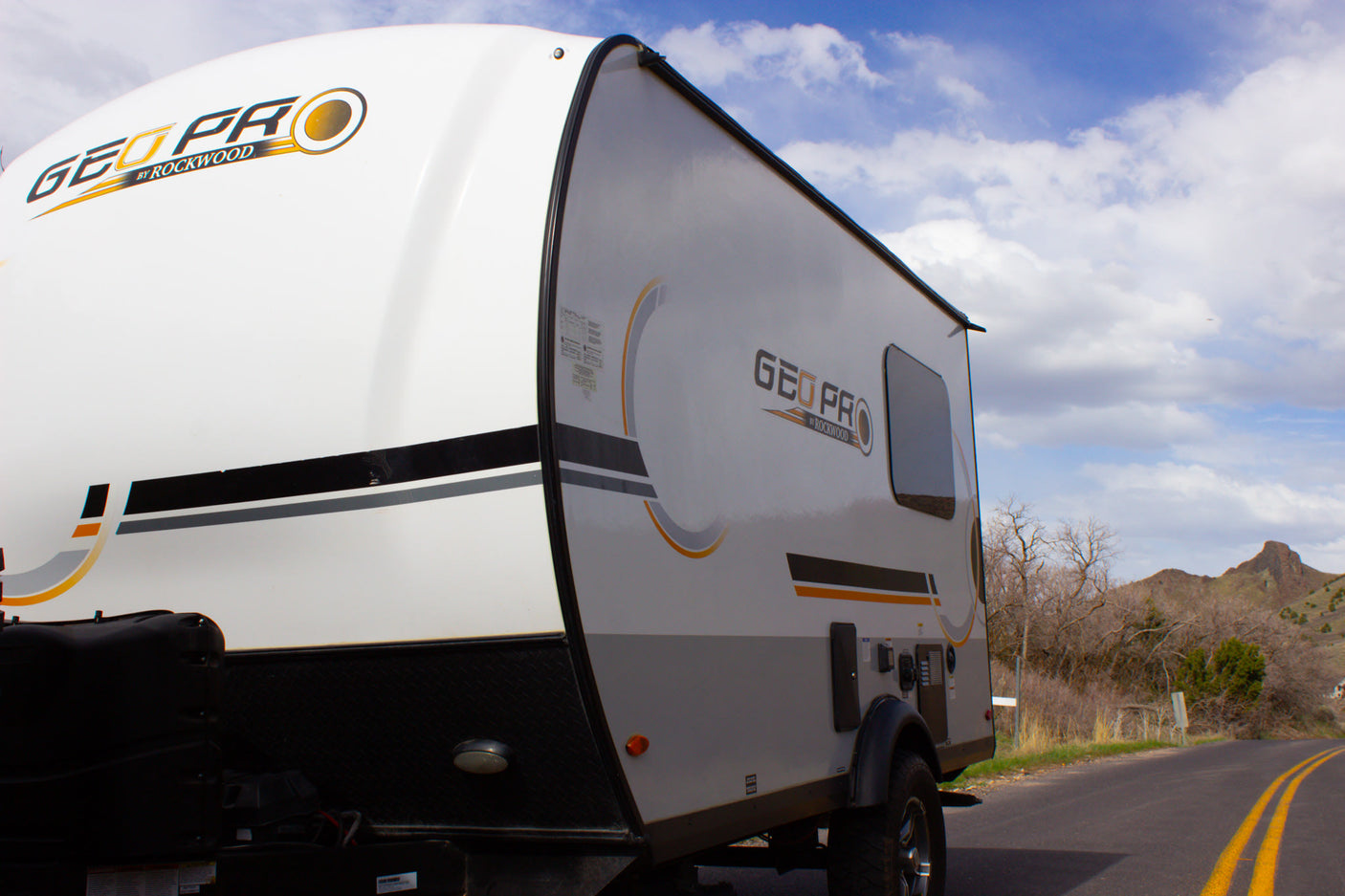 GEO PRO travel trailer RV rental, ready for a road trip. Explore mountains & sky with this compact camper.