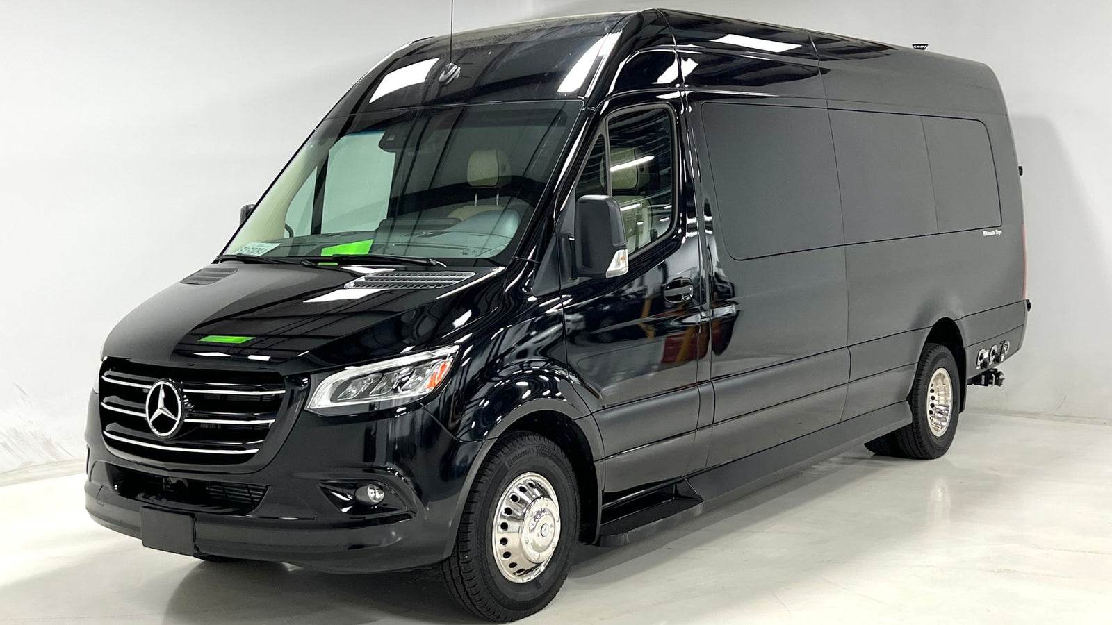 Experience luxury travel in this black Mercedes-Benz Sprinter camper van, ideal for rv rental. Sleek and polished.