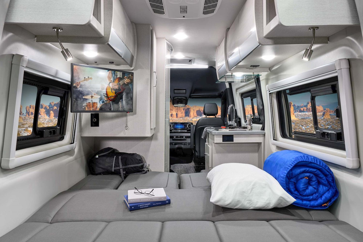 details the camper's layout with a fold-out sleeping area