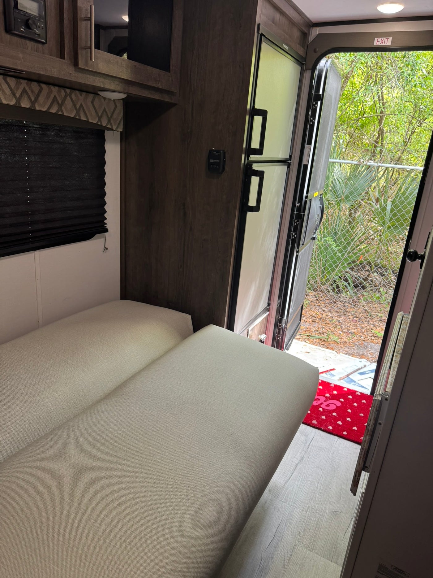ready for outdoor travel.|Inside an RV rental: light gray seating — photo 8