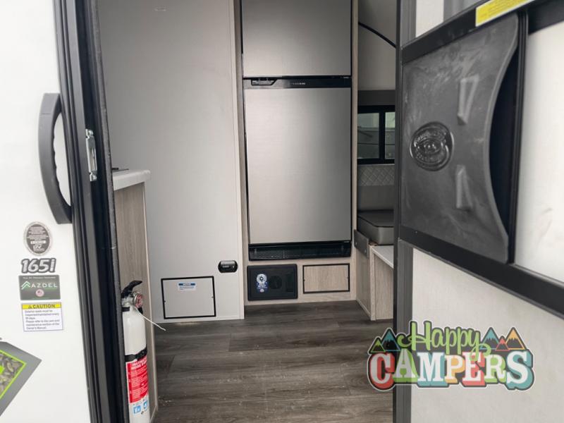 featuring an open door and rear spare tire