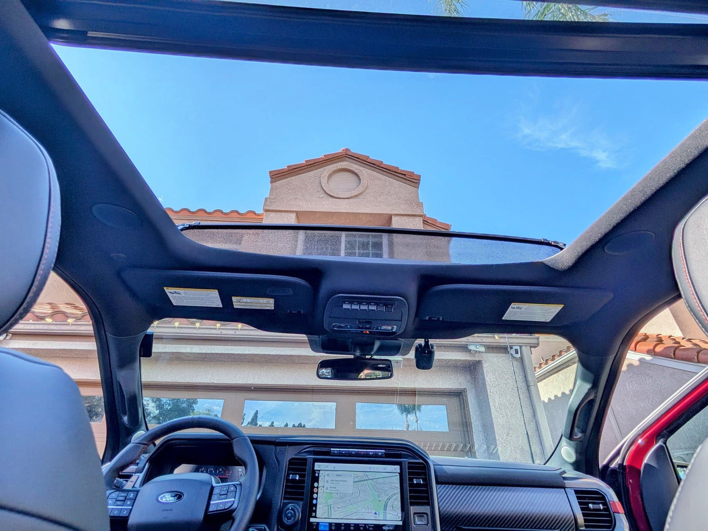 'FORD PERFORMANCE' display. Ideal for your rv rental adventures.|Spacious red pickup interior — photo 4