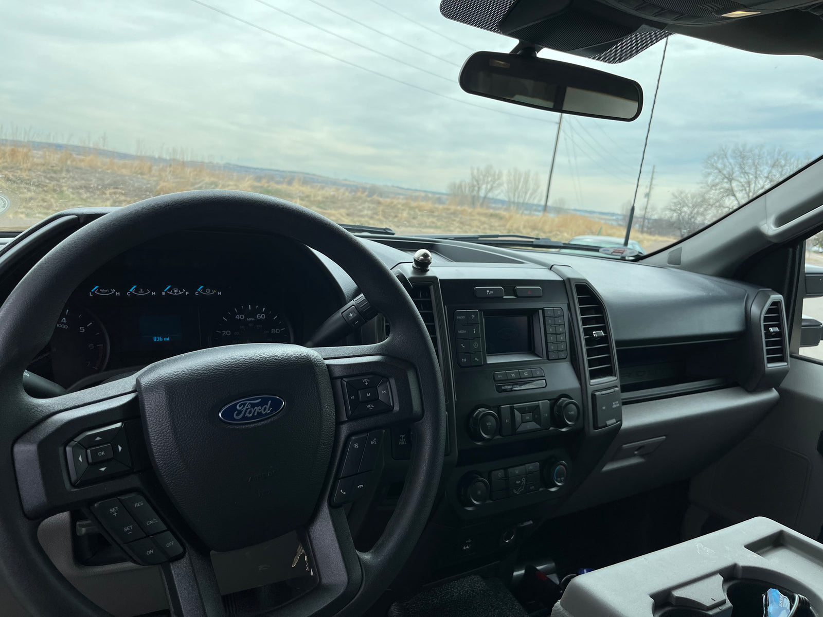 Ford truck interior: dashboard and steering wheel. Perfect for towing your RV rental or hauling gear for your next adventure.