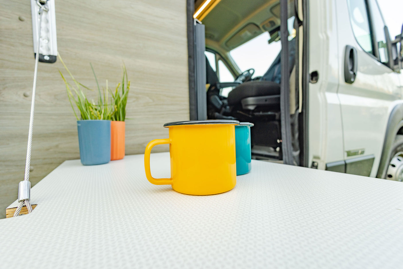 and front cabin ready for travel.|Well-equipped RV rental interior with elevated bed