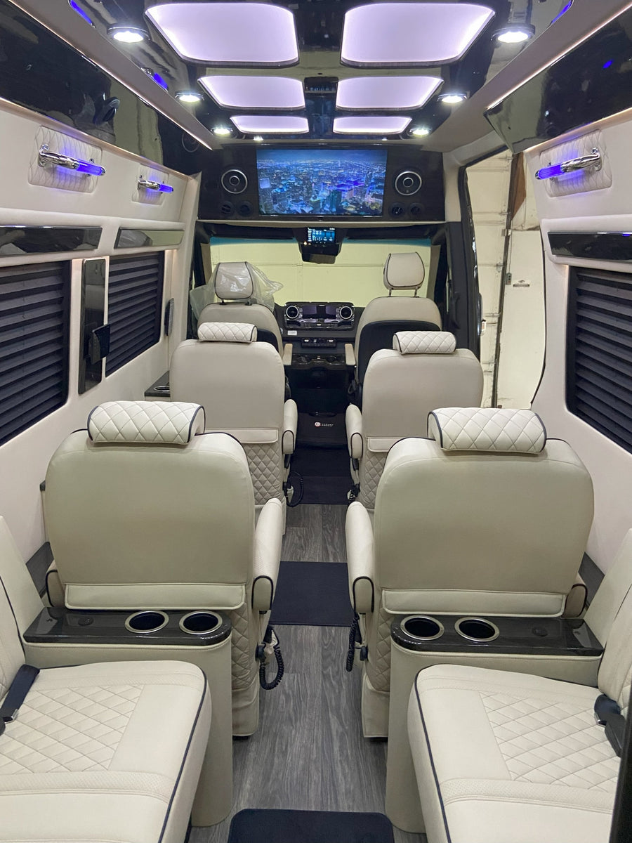 luxurious RV rental interior with cream quilted seats