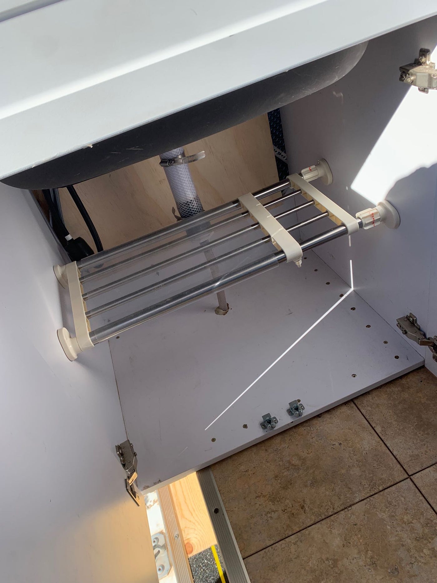 ideal for your next RV rental adventure.|RV rental: Compact wooden interior storage features a folding cot — photo 9