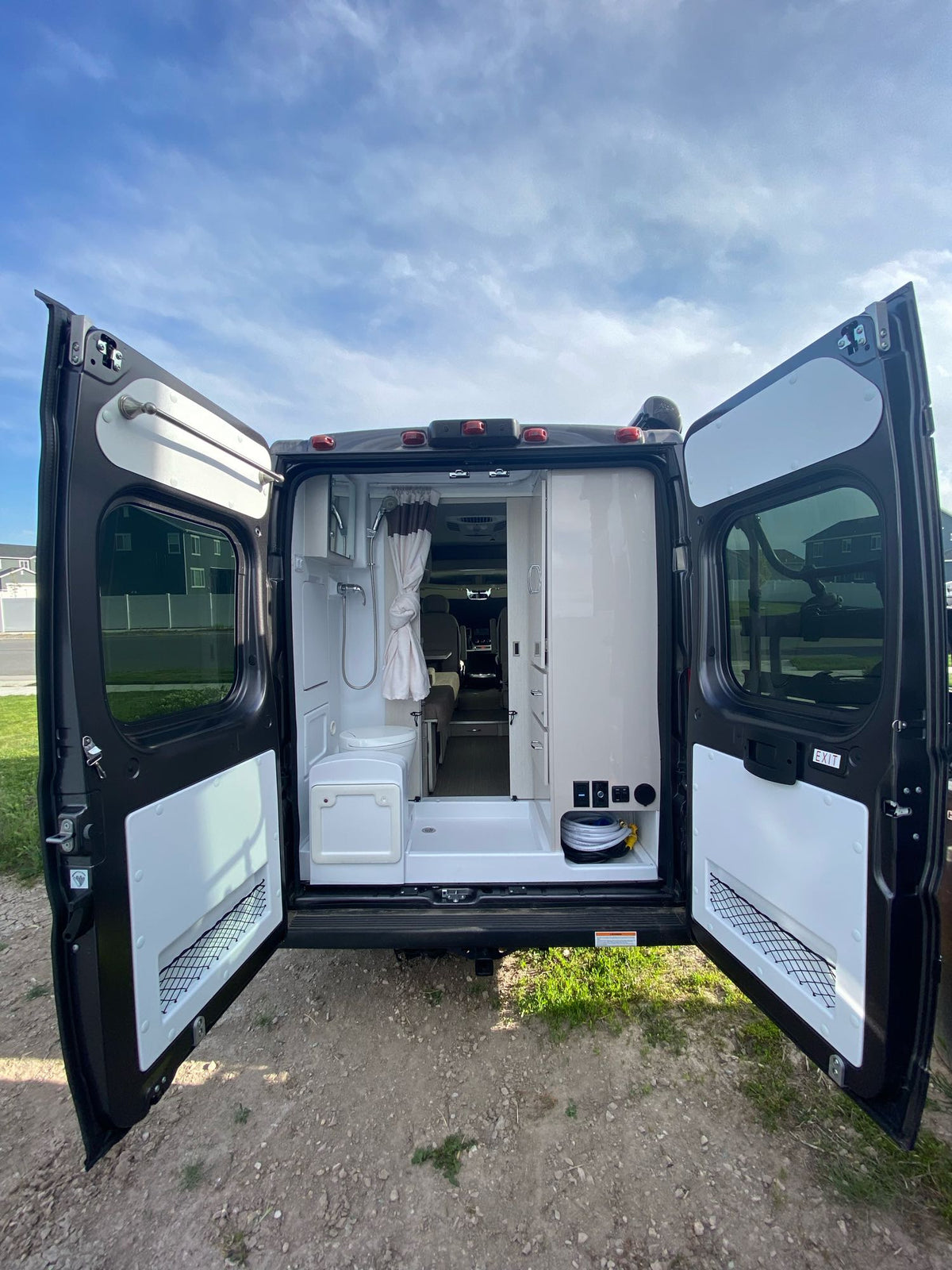 and scenic window view from the comfy bench.|RV rental's compact kitchen: cooktop — photo 14