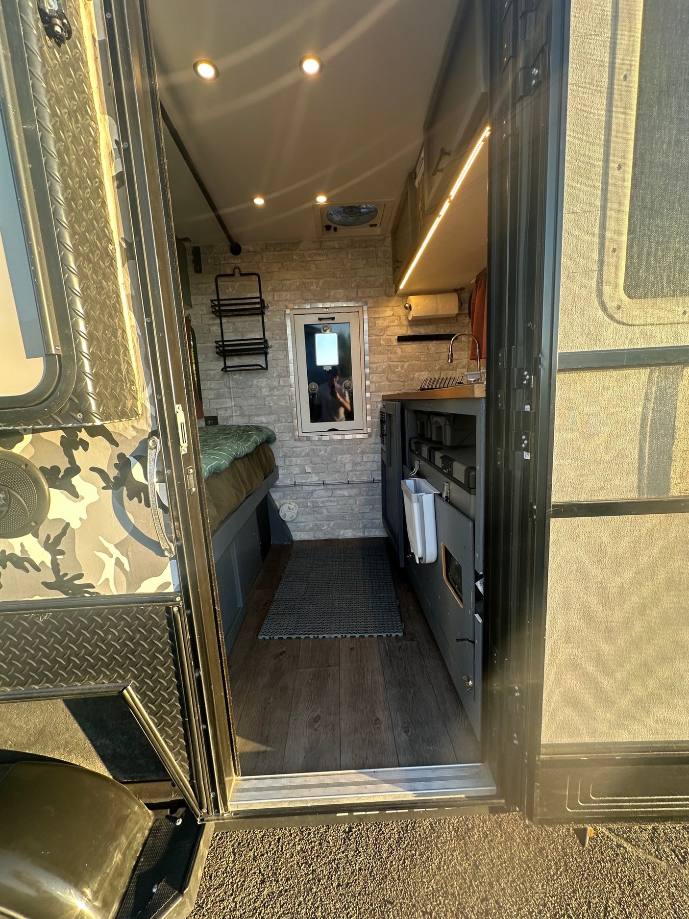 featuring a comfortable mattress for your next outdoor adventure.|Cozy rv rental sleeping area featuring a bed with patterned bedding