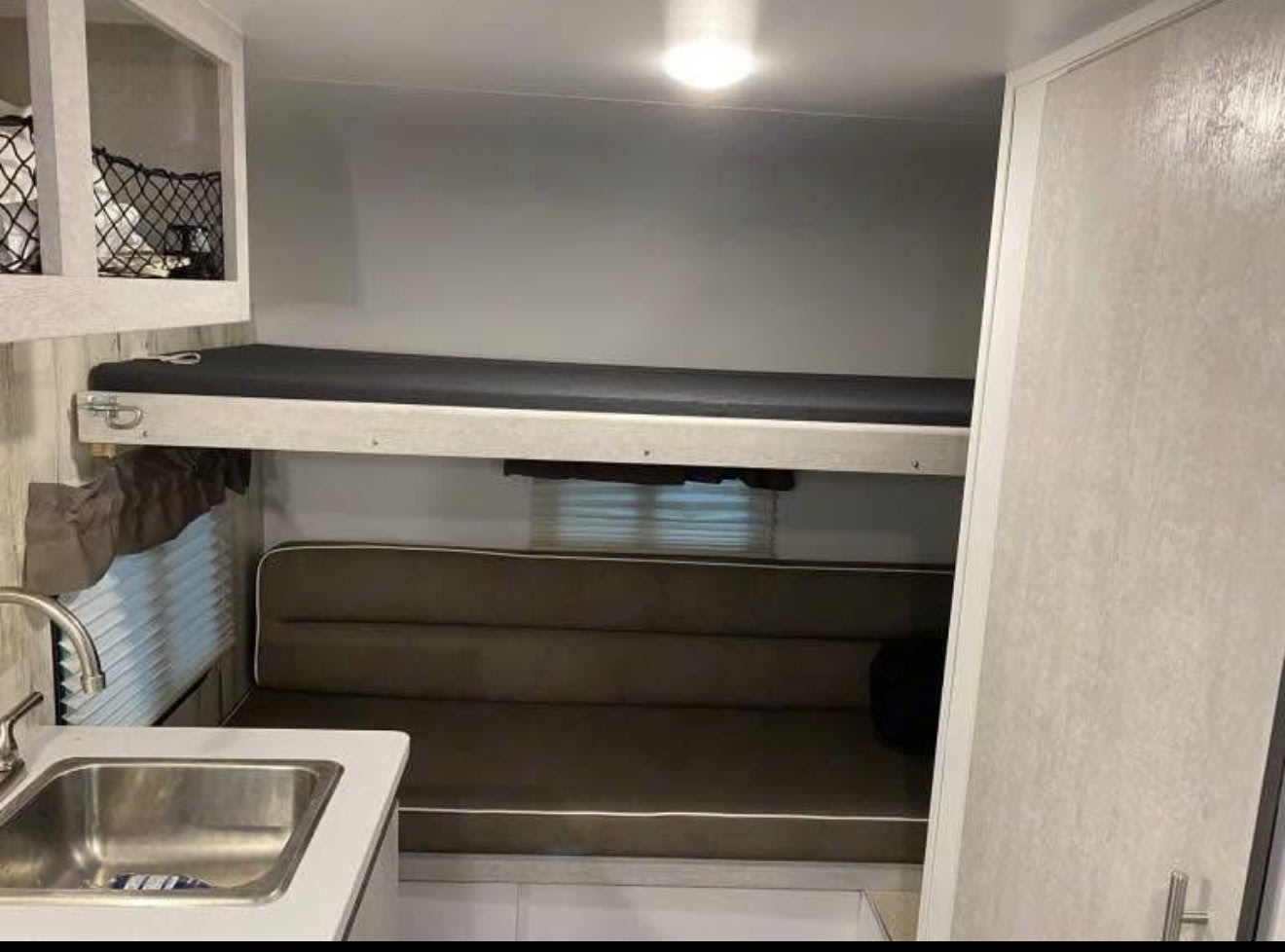 black door & windows.|White Rove Lite travel trailer