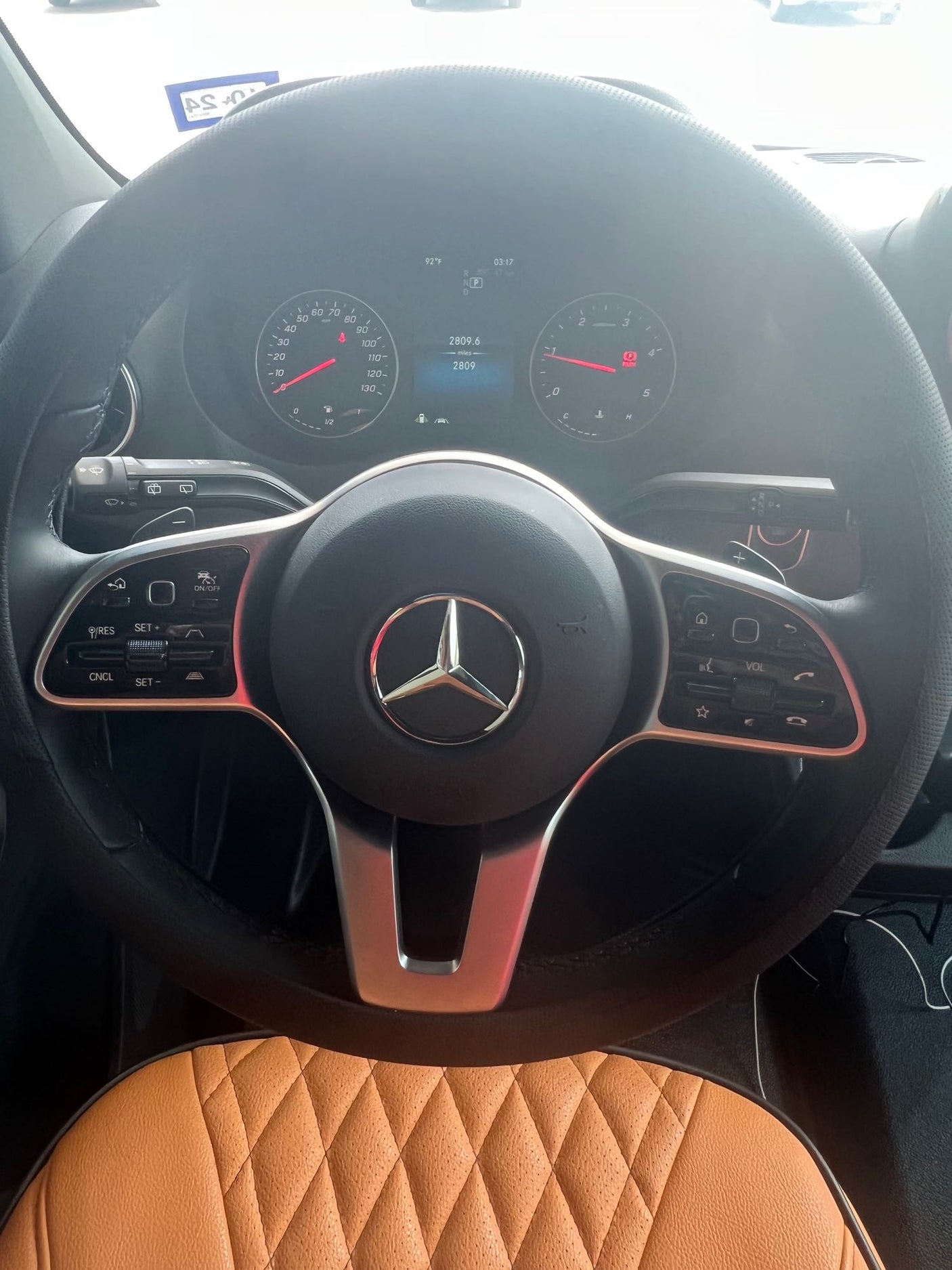 Detailed Mercedes-Benz vehicle interior, possibly an RV rental, showing steering wheel, digital dashboard, and 2809 miles.