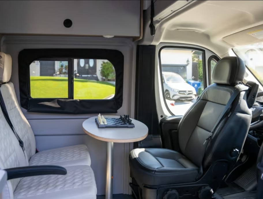ready for adventure.|Explore this RV rental's versatile camper van interior