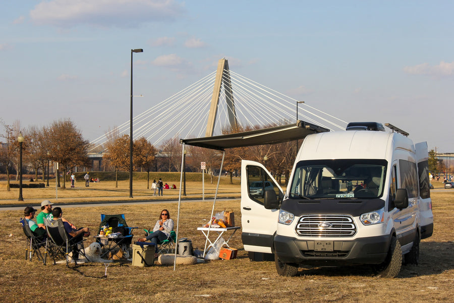 enjoying the outdoors near a bridge.|Inside an RV rental camper van