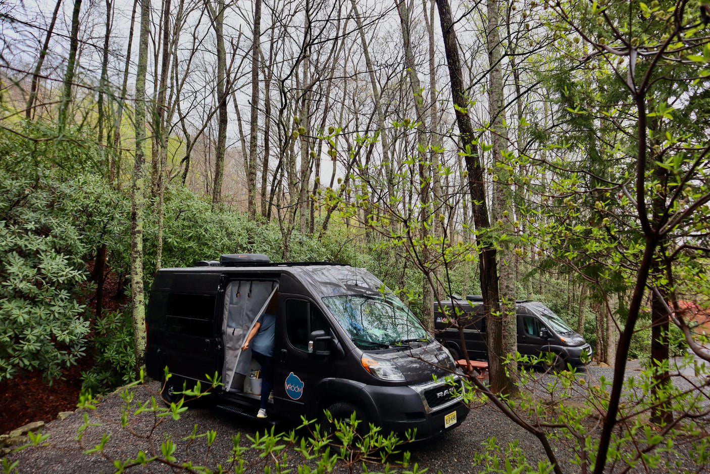 and Dometic fridge for your travels.|Inside an RV rental: a cozy bed above a built-in mini-fridge stocked with drinks