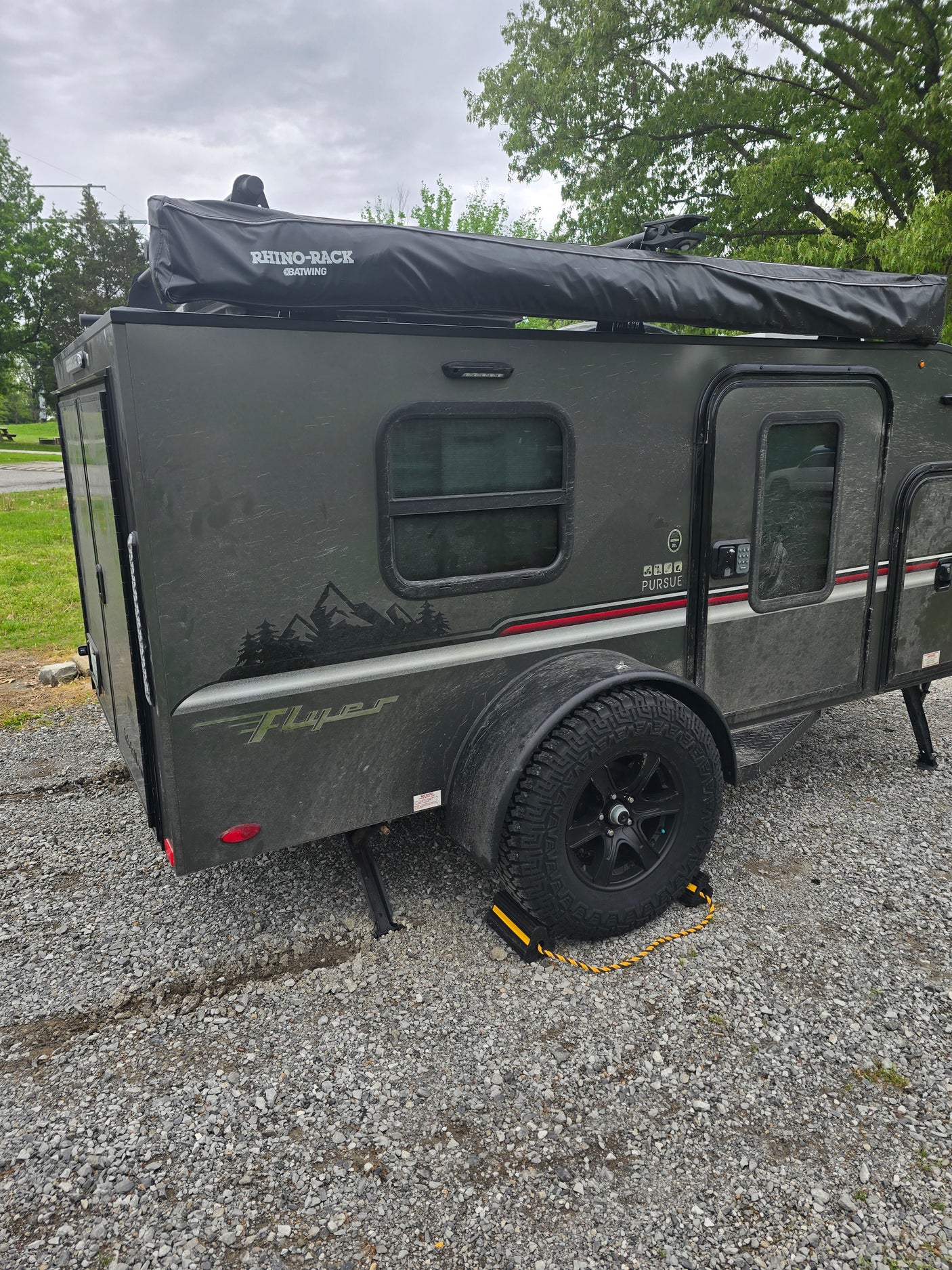 This rugged, dark gray Teardrop RV rental is ready for off-road camping and outdoor exploration.