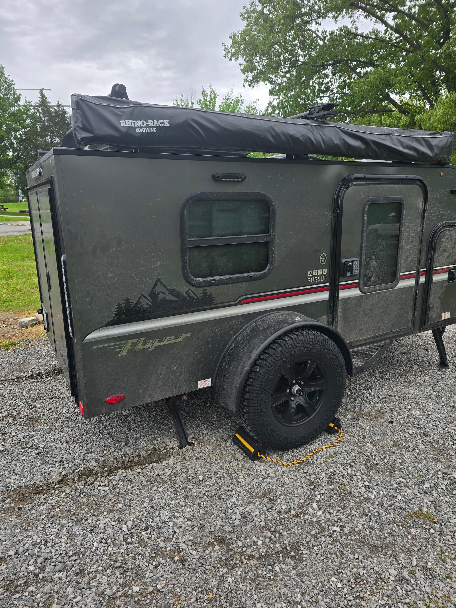 This rugged, dark gray Teardrop RV rental is ready for off-road camping and outdoor exploration.