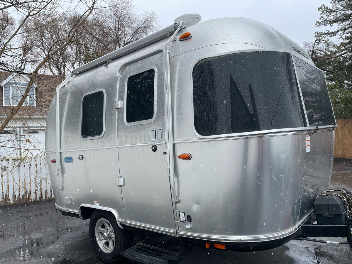 A shiny silver Airstream travel trailer