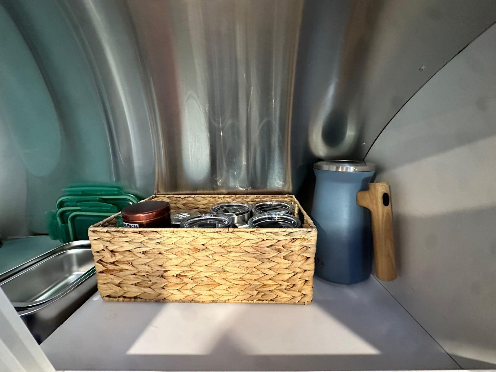 and fridge for comfortable travel.|Modern RV rental kitchen with stainless sink