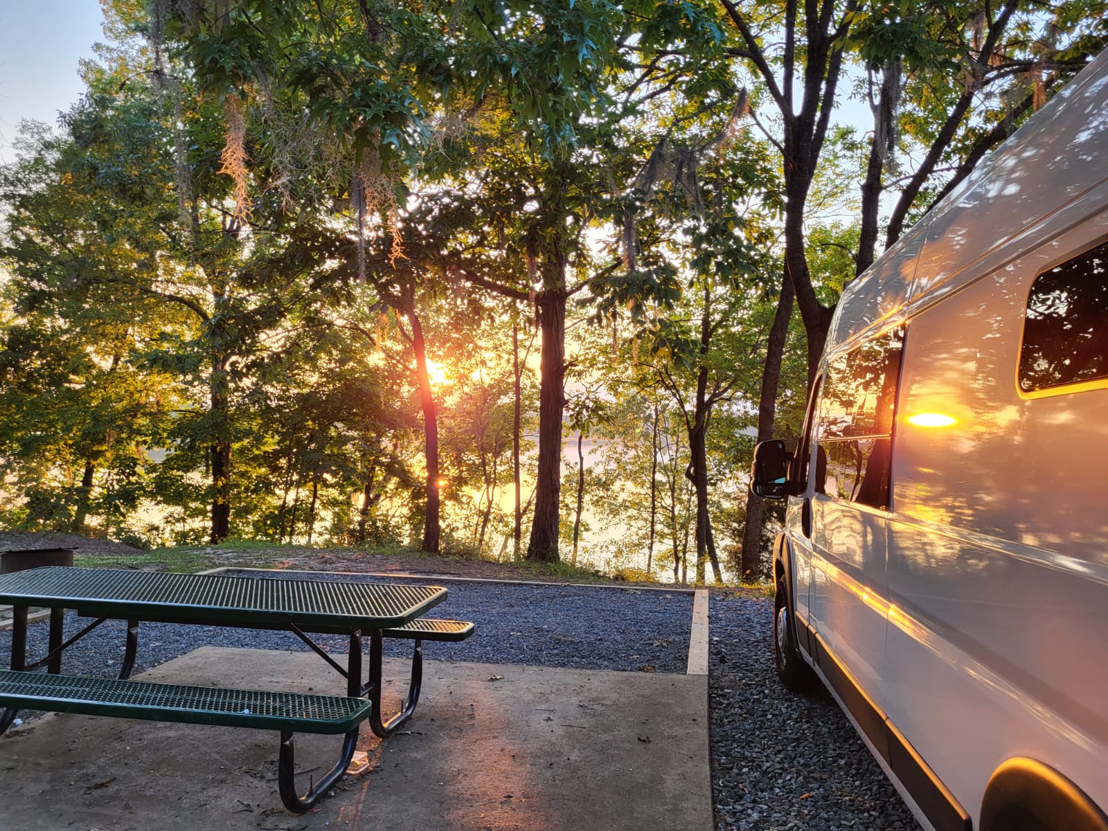 and white cabinets.|RV rental ready: modern van conversion with bed