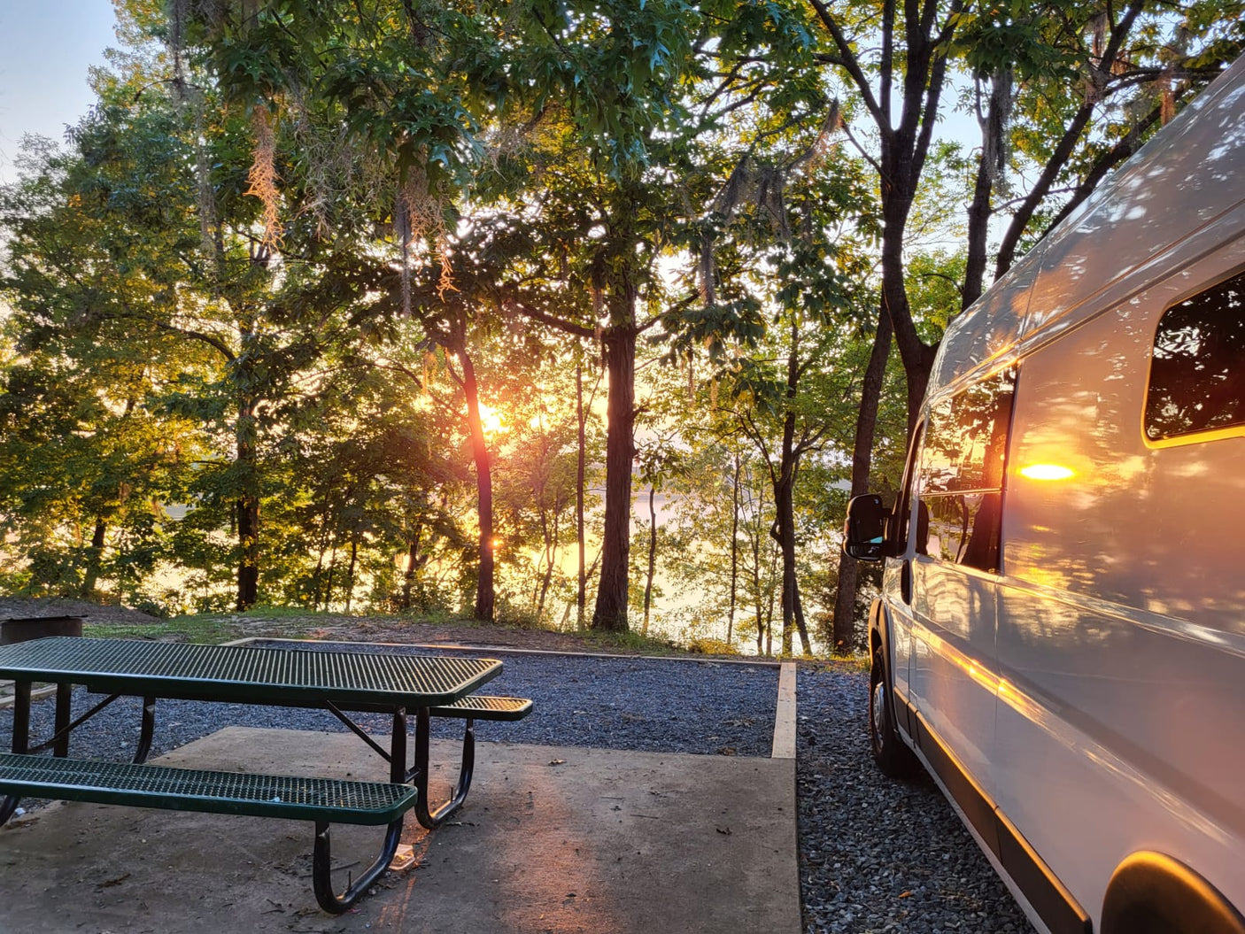 and white cabinets.|RV rental ready: modern van conversion with bed