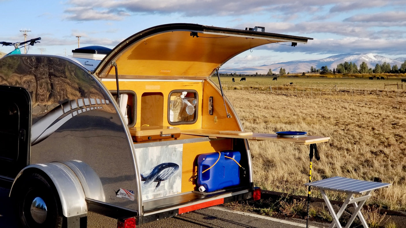 lakeside.|An **rv rental**'s rear kitchen setup with stove