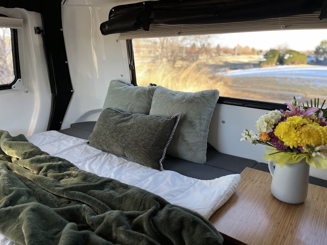 and an evening view. Perfect camper.|Relaxing RV rental interior: wine