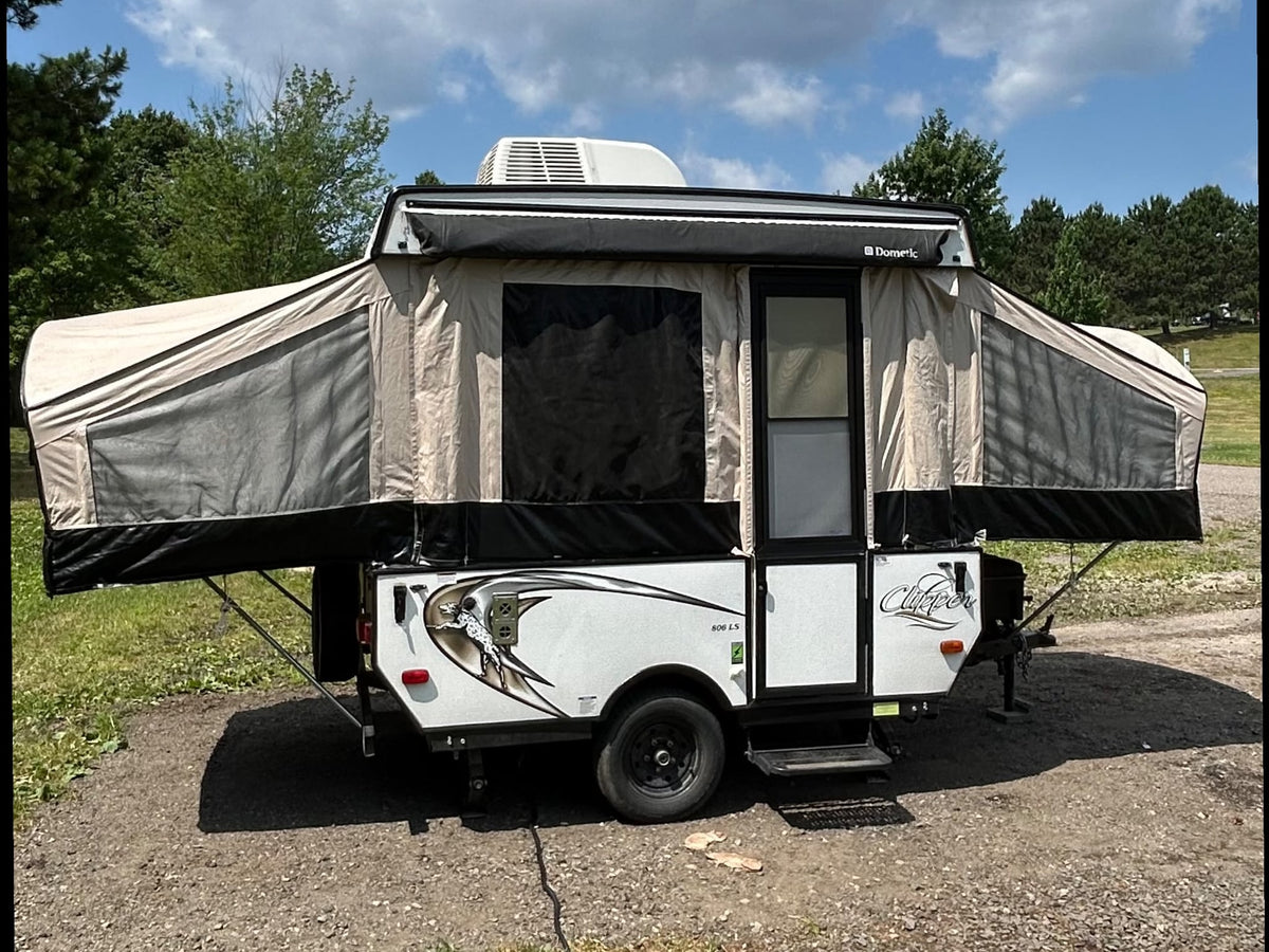 ideal for your next rv rental adventure. It features canvas sides — photo 2