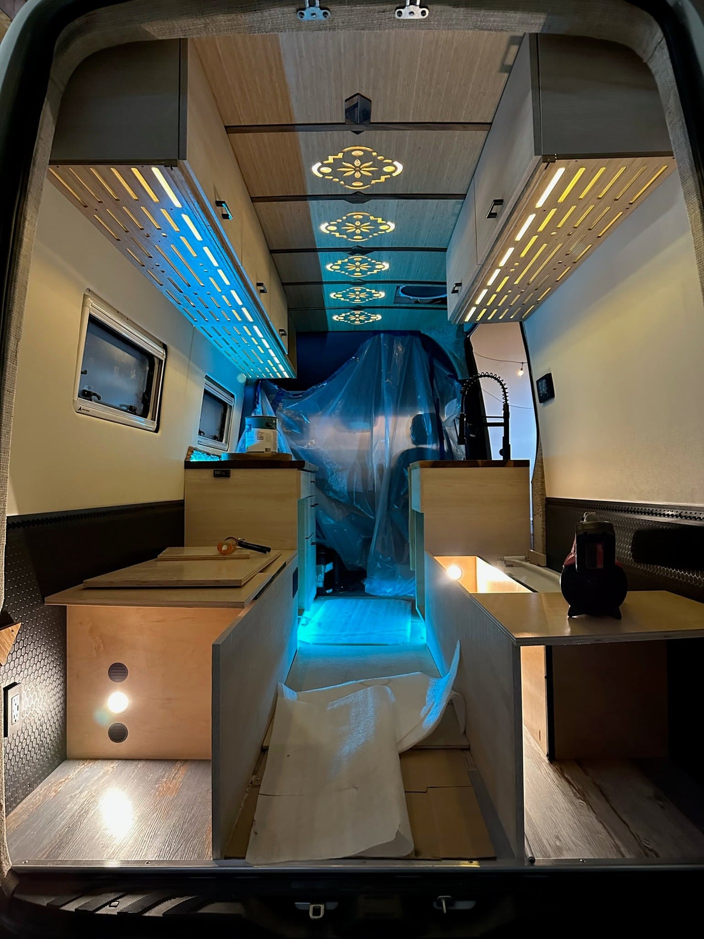 and scenic outdoor view from the front cabin.|RV rental: Camper van kitchenette with a copper sink