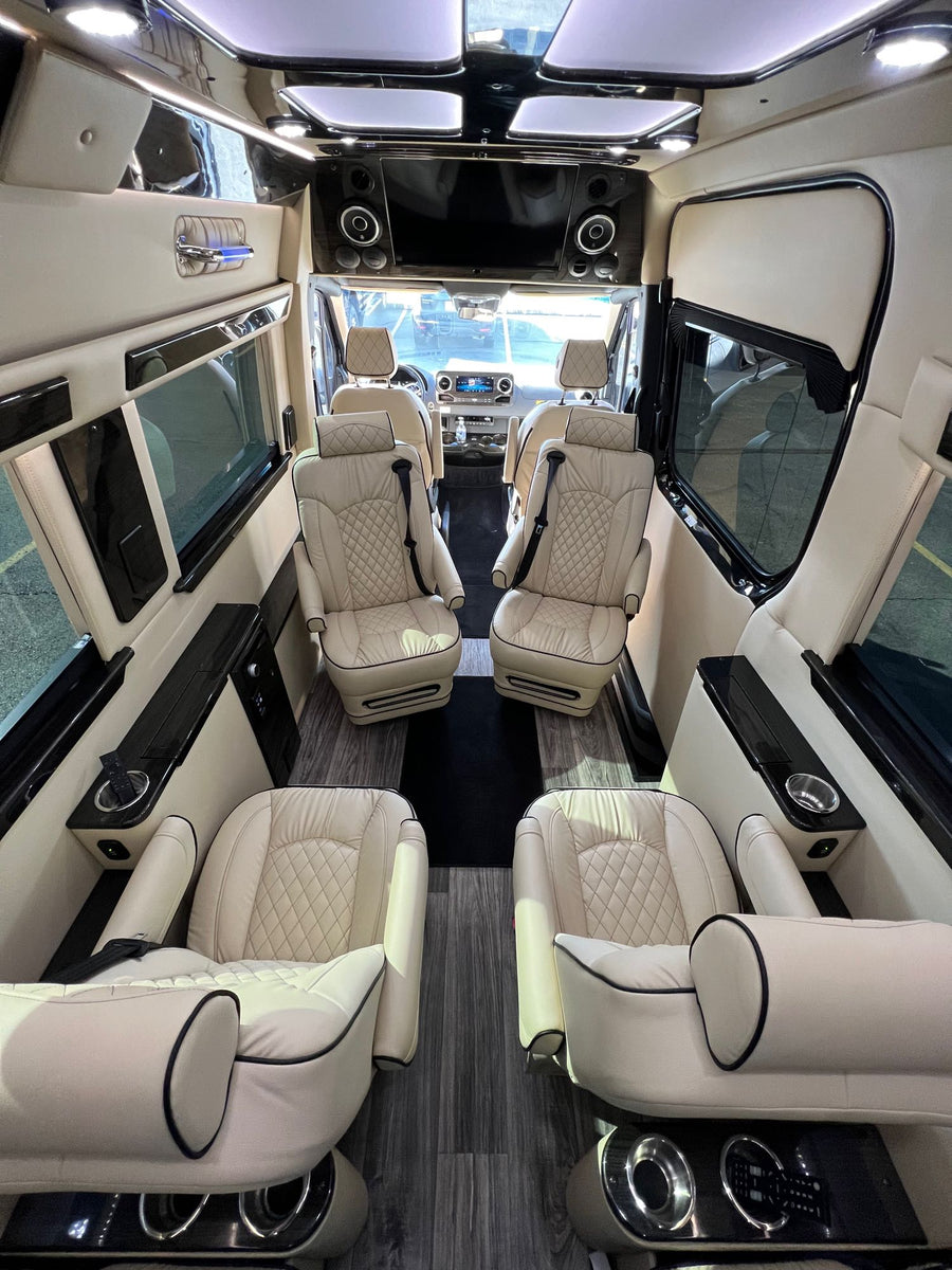 Step inside this upscale RV rental: cream leather captain's chairs