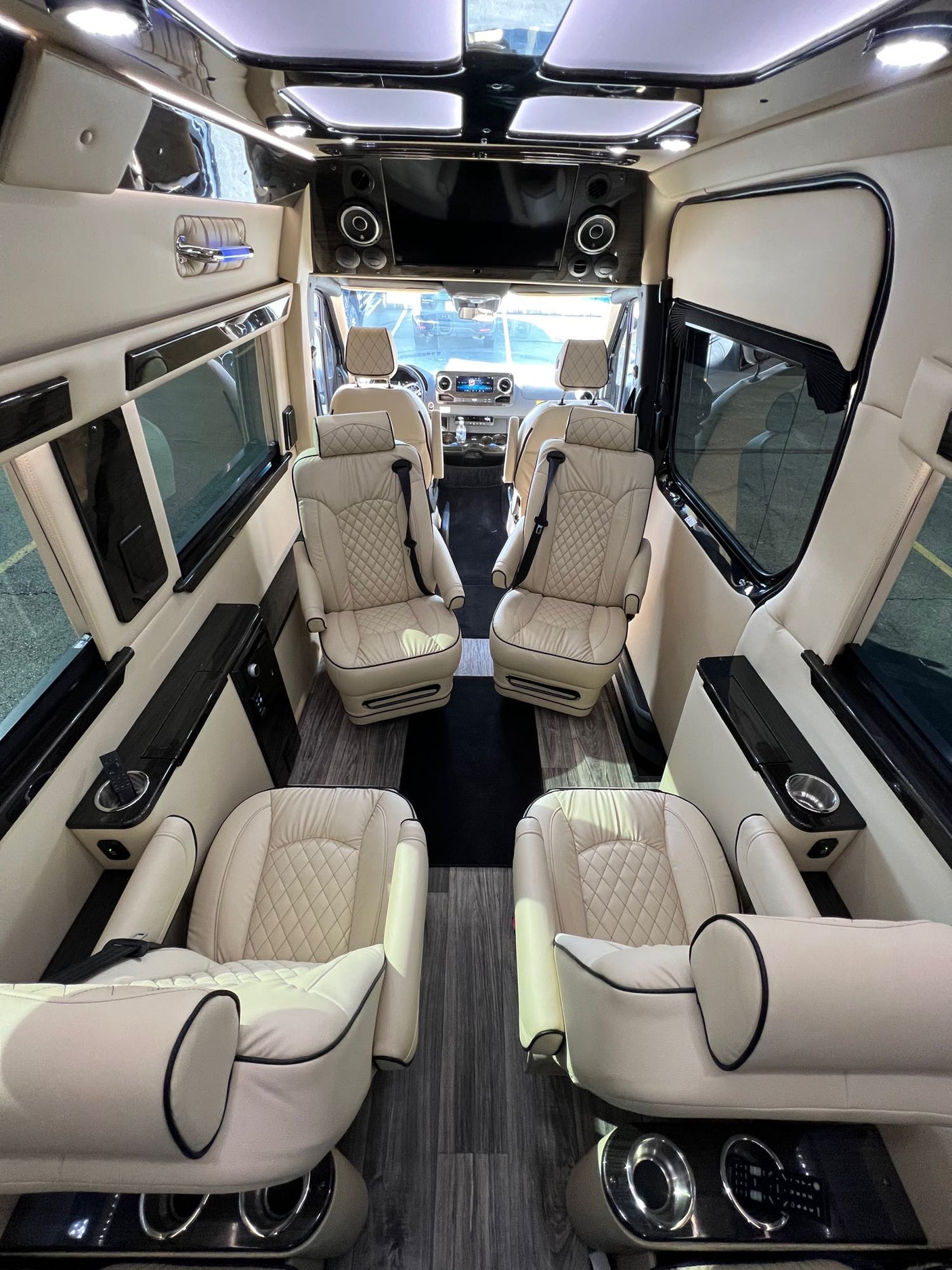 Step inside this upscale RV rental: cream leather captain's chairs