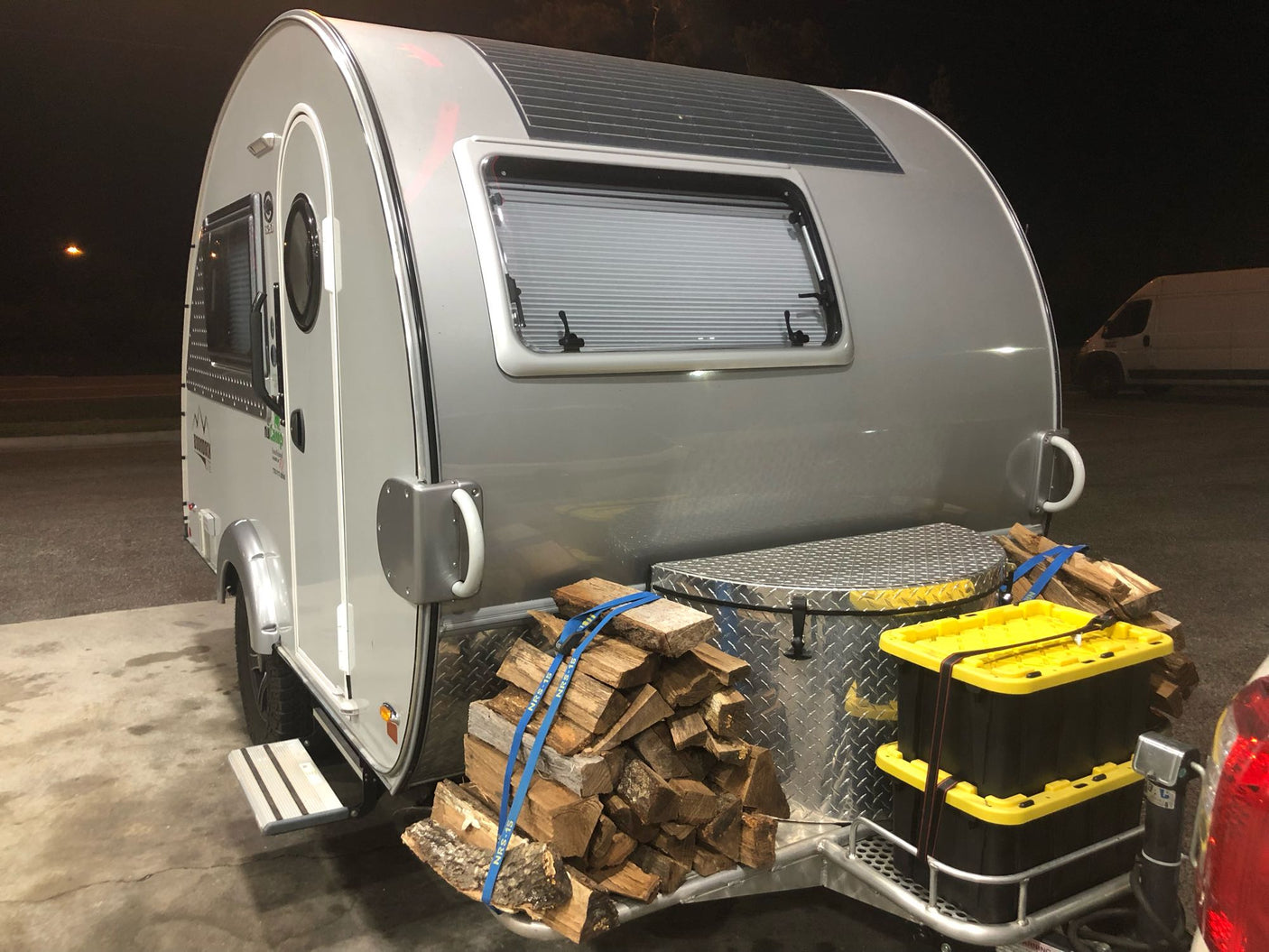 and toilet with a unique round window.|An RV rental's Jensen JWM70A stereo