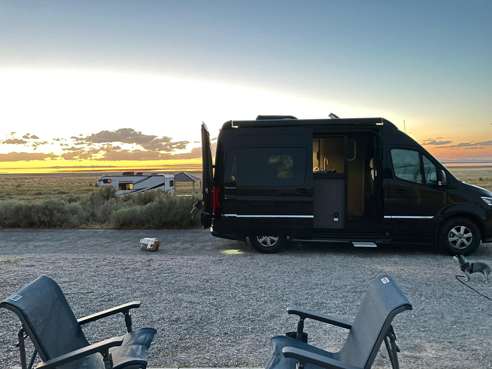 RV rental sunset: Black camper van