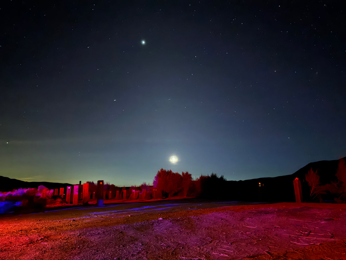 Stars, planets & illuminated art light up this desert night. Book an RV rental for your unique astrophotography escape!