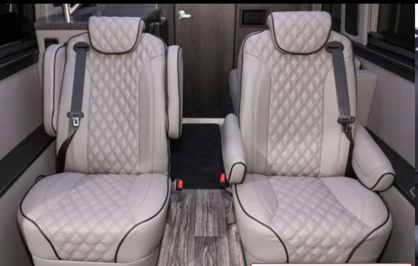 Plush, diamond-quilted captain's chairs in an RV rental interior, offering comfort for passengers. — photo 8